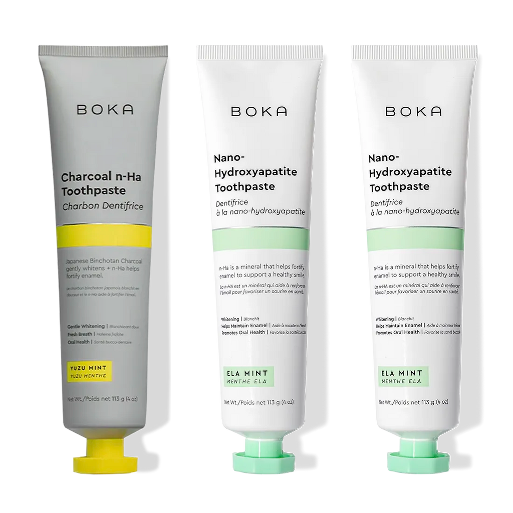 Three Charcoal Yuzu Mint Whitening n-Ha Toothpaste 3-packs, displayed upright on a white surface.