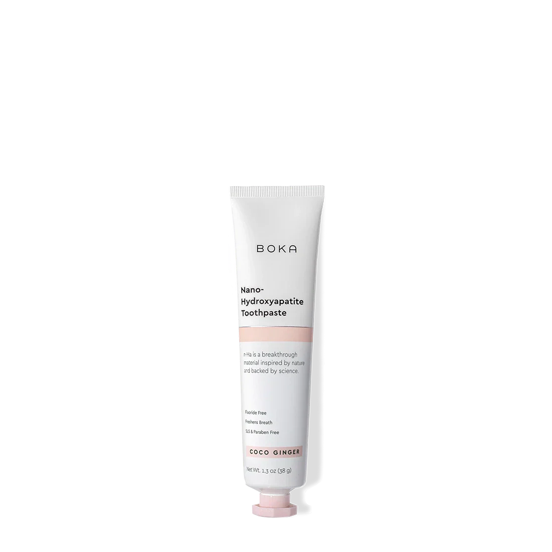 A tube of Coco Ginger Travel Size n-Ha Toothpaste on a plain background.