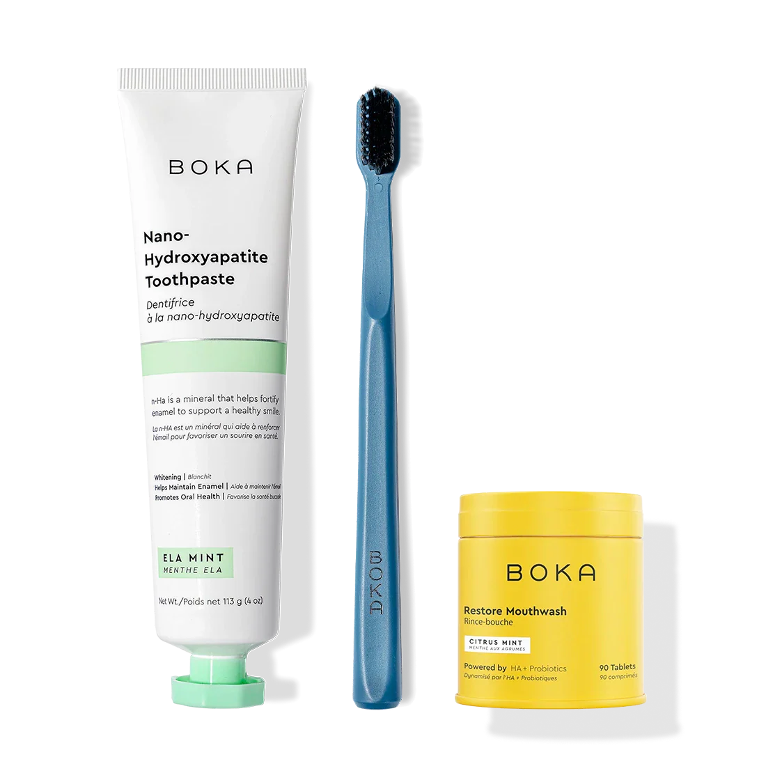 Fresh Faced toothpaste, blue charcoal-bristle toothbrush, and yellow Restore Mouthwash bottle.