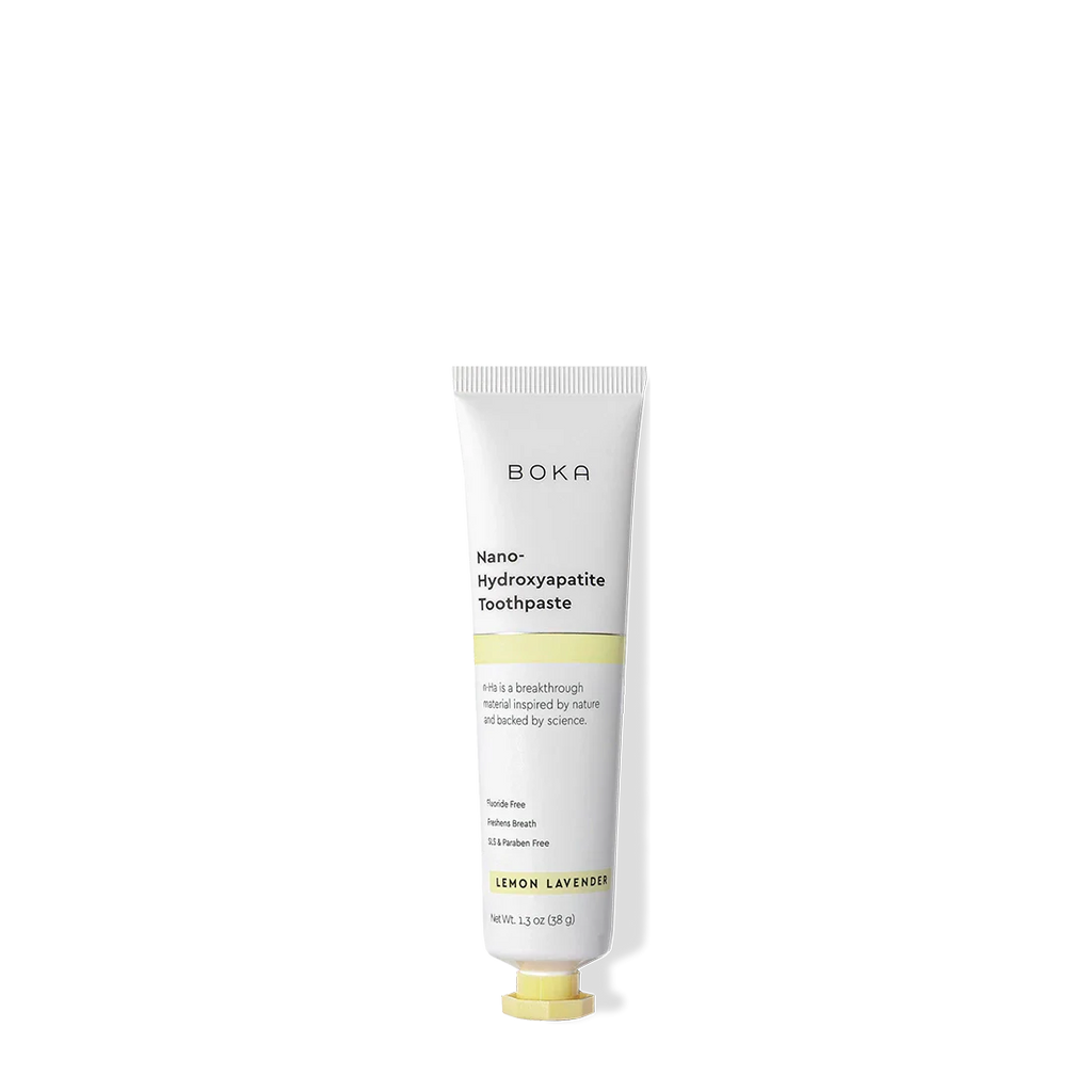 A white tube of Lemon Lavender Travel Size n-Ha Toothpaste on a black background.