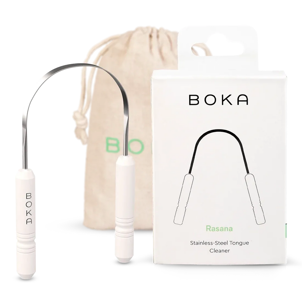Boka stainless steel tongue cleaner with packaging and drawstring bag on a white background