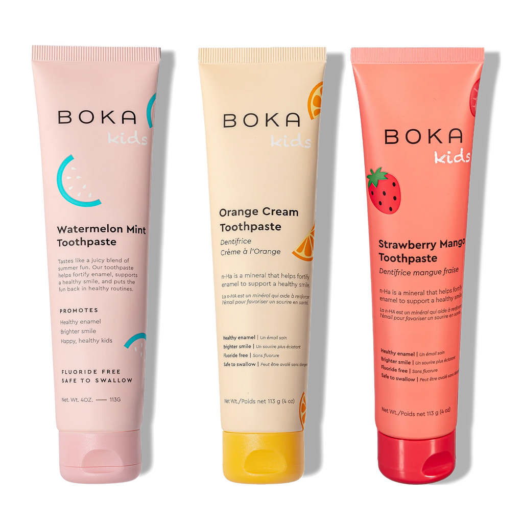 Three tubes of Boka toothpaste in different flavors on a white background