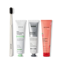 Collection of Boka toothpaste and a toothbrush on a white background